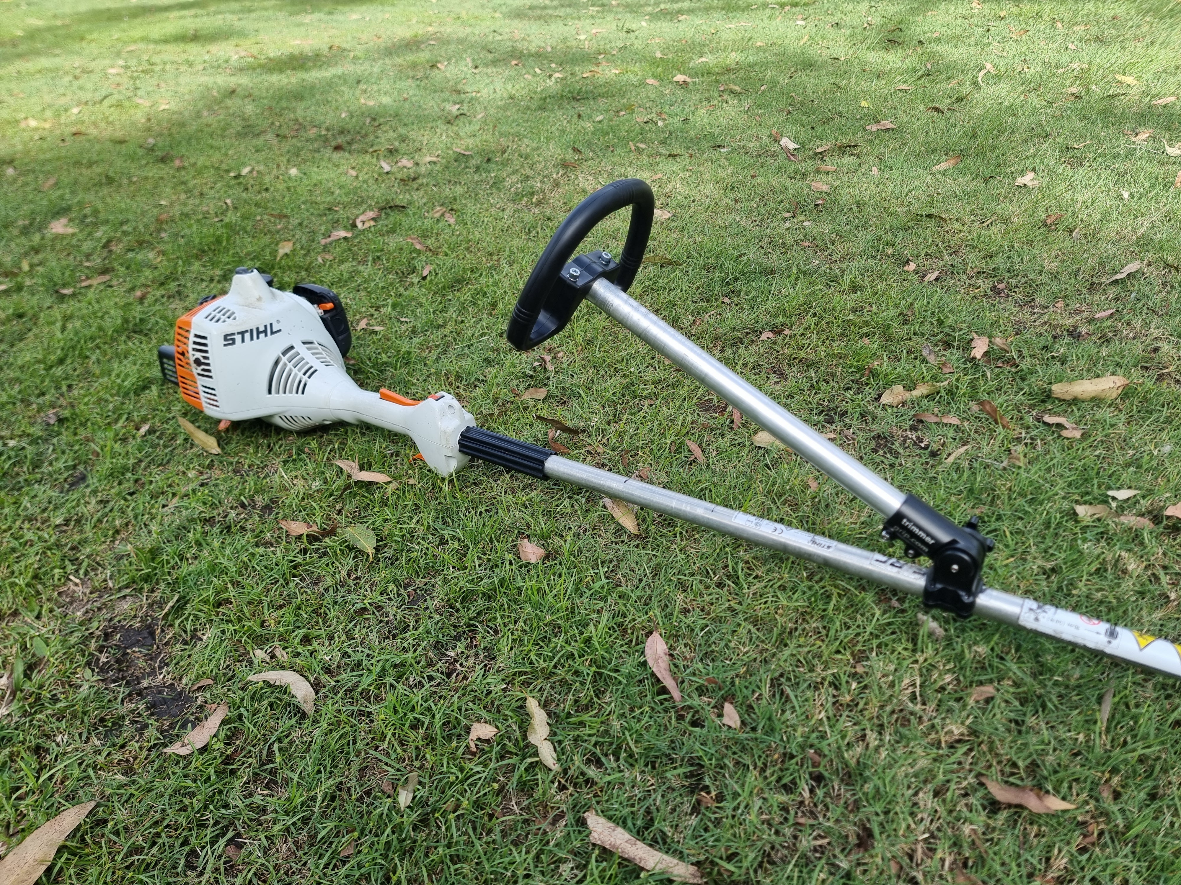 Grass trimmer clearance handle